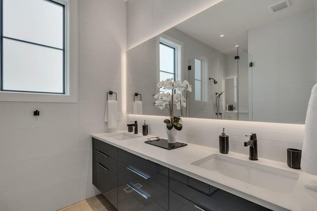 7313 Harlow Dr, College Grove, TN 37046 - bathroom featuring tile walls, double vanity, and walk in shower
