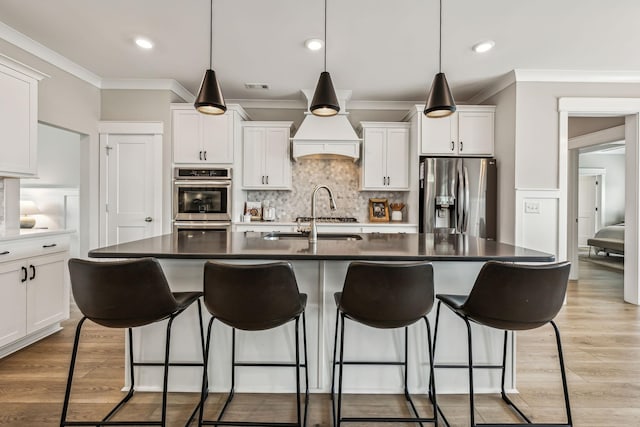 6404 Mottled Duck Dr, Murfreesboro, TN 37128 - kitchen with appliances with stainless steel finishes, ornamental molding, backsplash, a kitchen bar, and white cabinetry