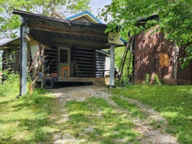 105 Log Home Ln, Moss, TN 38575 - rear view of house with a lawn