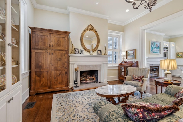 224 3rd Ave S, Franklin, TN 37064 - living area featuring a premium fireplace, dark wood-style flooring, crown molding, recessed lighting, and baseboards