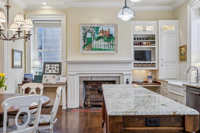 224 3rd Ave S, Franklin, TN 37064 - kitchen featuring a sink, dishwasher, dark wood-style flooring, light stone countertops, and crown molding