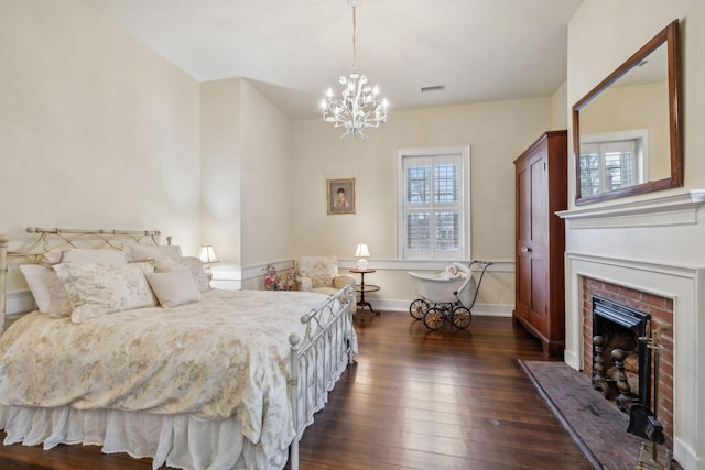 224 3rd Ave S, Franklin, TN 37064 - bedroom featuring dark wood finished floors, a fireplace, a chandelier, and baseboards