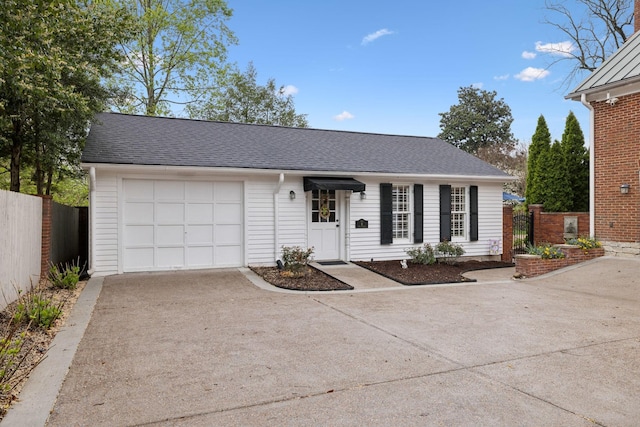 224 3rd Ave S, Franklin, TN 37064 - view of front of home featuring concrete driveway, an attached garage, and roof with shingles