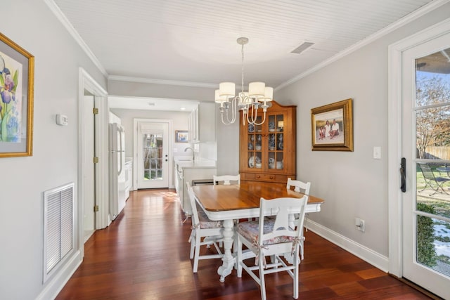 224 3rd Ave S, Franklin, TN 37064 - dining room with a chandelier, dark wood finished floors, crown molding, and baseboards