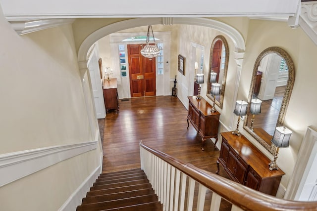 224 3rd Ave S, Franklin, TN 37064 - foyer with dark wood-type flooring, arched walkways, a chandelier, and stairway