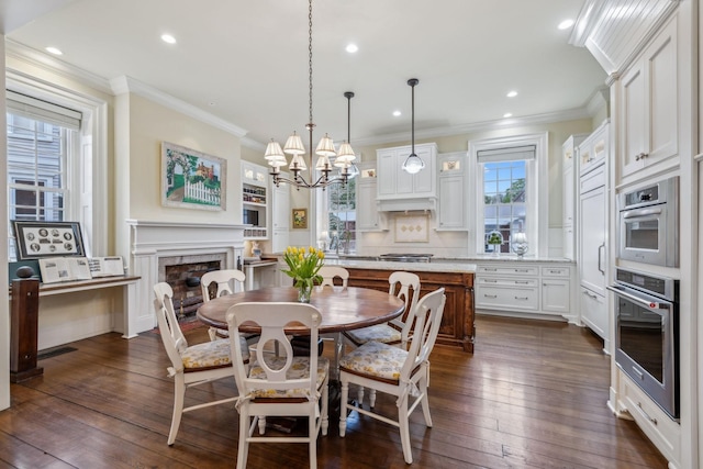 224 3rd Ave S, Franklin, TN 37064 - dining space featuring a chandelier, dark wood-type flooring, ornamental molding, recessed lighting, and a premium fireplace