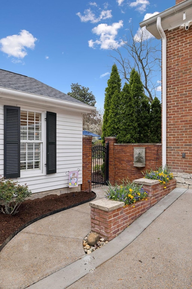 224 3rd Ave S, Franklin, TN 37064 - view of exterior entry with a gate and a shingled roof