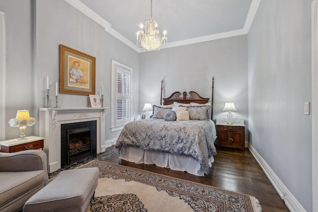 224 3rd Ave S, Franklin, TN 37064 - bedroom with a chandelier, dark wood-type flooring, a fireplace with flush hearth, ornamental molding, and baseboards