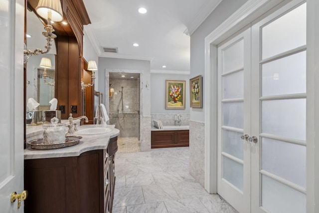 224 3rd Ave S, Franklin, TN 37064 - full bath featuring french doors, crown molding, a tile shower, vanity, and recessed lighting