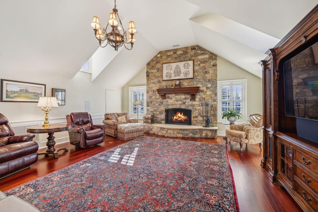 224 3rd Ave S, Franklin, TN 37064 - living room with a stone fireplace, vaulted ceiling, dark wood-style floors, and a chandelier