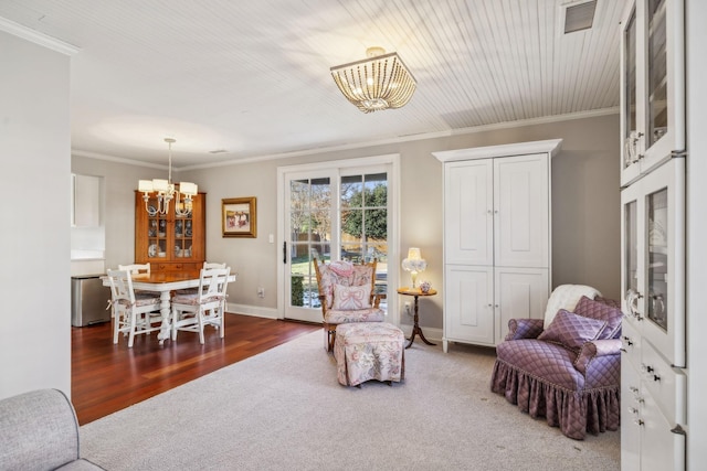 224 3rd Ave S, Franklin, TN 37064 - living area featuring a chandelier, crown molding, carpet floors, baseboards, and wood finished floors