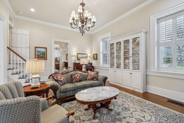 224 3rd Ave S, Franklin, TN 37064 - living area with wood finished floors, a chandelier, crown molding, baseboards, and stairway