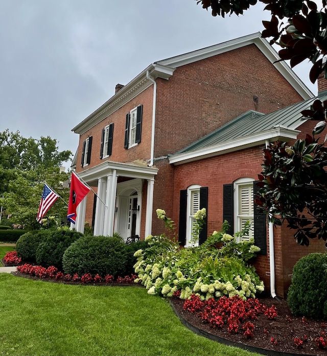 224 3rd Ave S, Franklin, TN 37064 - view of front facade with a front lawn, brick siding, and a chimney