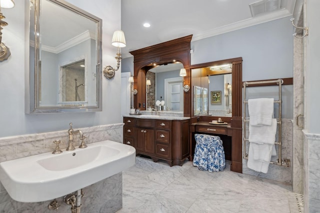 224 3rd Ave S, Franklin, TN 37064 - bathroom featuring ornamental molding, wainscoting, tile walls, a sink, and marble finish floors