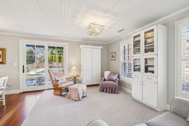 224 3rd Ave S, Franklin, TN 37064 - sitting room featuring plenty of natural light, ornamental molding, a chandelier, baseboards, and wood finished floors