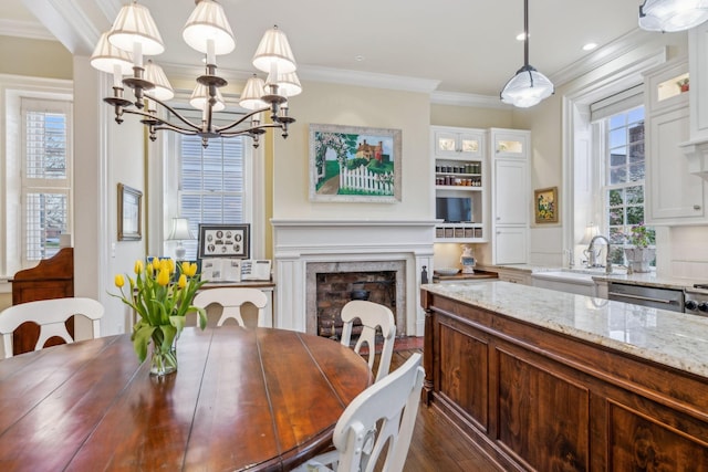224 3rd Ave S, Franklin, TN 37064 - dining space with ornamental molding, dark wood-style floors, a chandelier, a fireplace, and recessed lighting