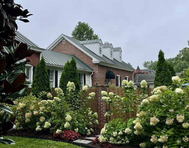 224 3rd Ave S, Franklin, TN 37064 - view of front of house featuring a standing seam roof, brick siding, and metal roof