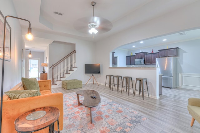 5115 Heroes Ln, Murfreesboro, TN 37129 - living room with light wood finished floors, a ceiling fan, stairs, recessed lighting, and a raised ceiling