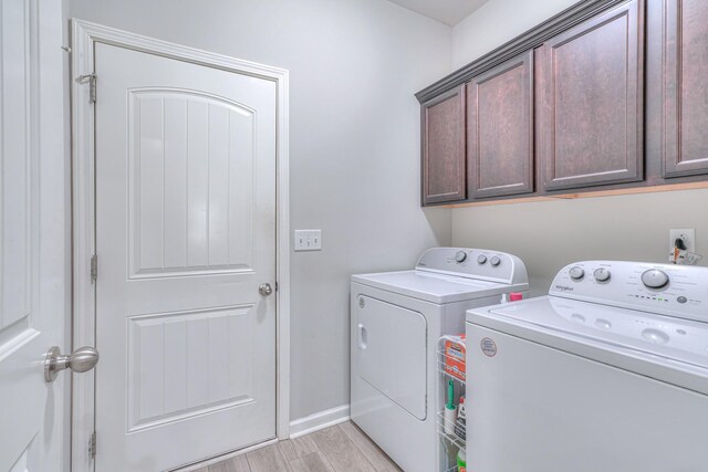 5115 Heroes Ln, Murfreesboro, TN 37129 - laundry area with washer and clothes dryer, cabinet space, and light wood-style flooring