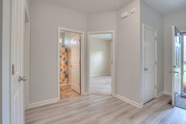 5115 Heroes Ln, Murfreesboro, TN 37129 - unfurnished bedroom featuring light wood-style floors, baseboards, and ensuite bathroom