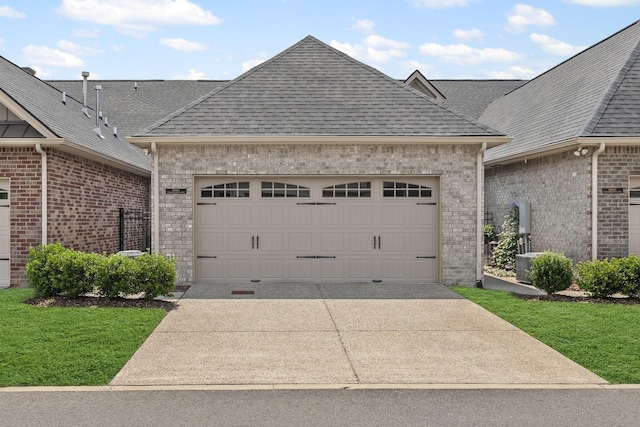 6061 Starboard Ln, Franklin, TN 37064 - view of front of home featuring brick siding, roof with shingles, a garage, and driveway