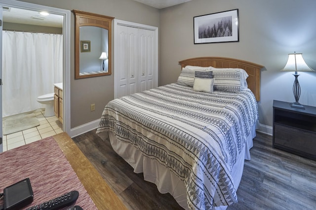 818 Golf View Blvd Unit 1303, Pigeon Forge, TN 37863 - bedroom with a closet, baseboards, wood finished floors, and connected bathroom