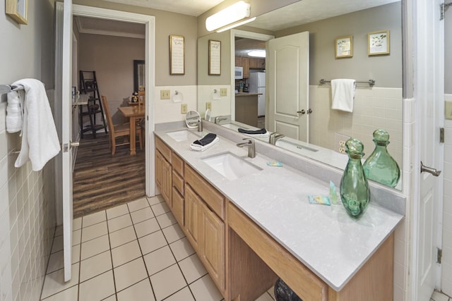 818 Golf View Blvd Unit 1303, Pigeon Forge, TN 37863 - bathroom with tile walls, tile patterned floors, double vanity, and wainscoting