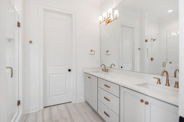 3150 Long Branch Cir, Franklin, TN 37064 - full bathroom featuring a stall shower, double vanity, a chandelier, and baseboards