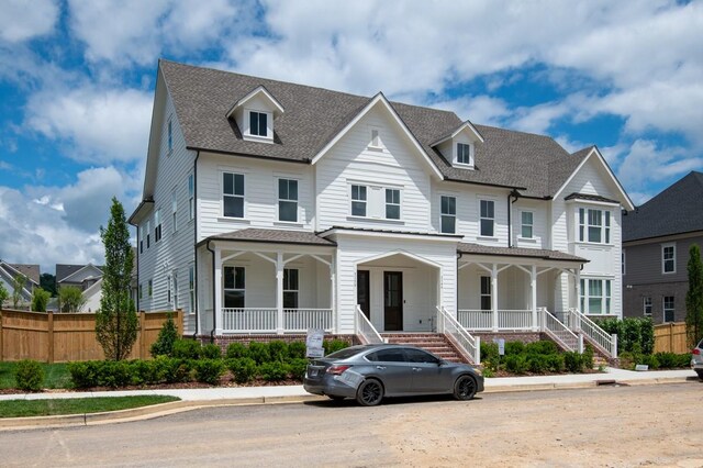 3150 Long Branch Cir, Franklin, TN 37064 - townhome / multi-family property with covered porch, a shingled roof, and stairs