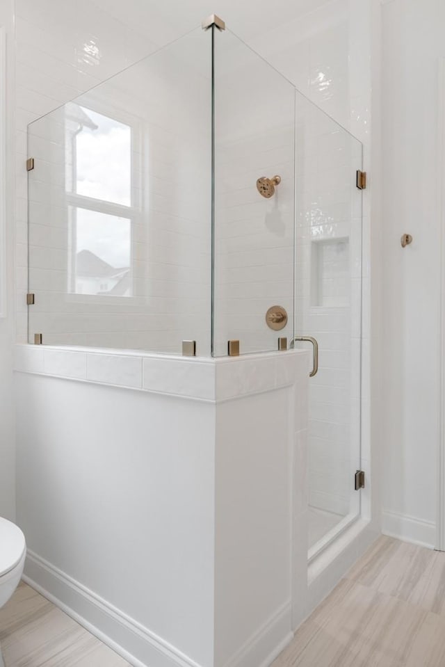 3150 Long Branch Cir, Franklin, TN 37064 - bathroom with baseboards, a shower stall, and toilet