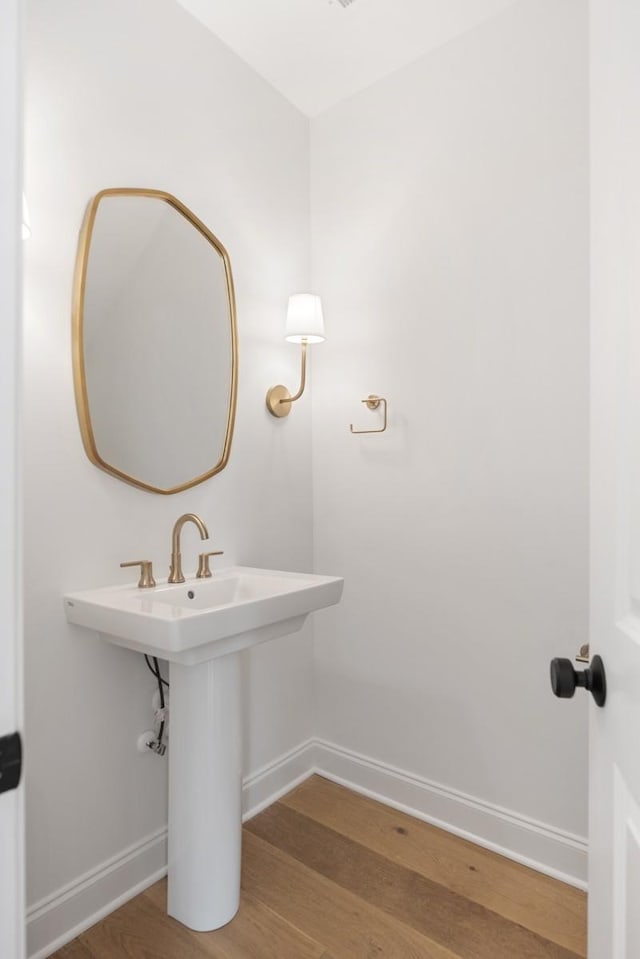 3150 Long Branch Cir, Franklin, TN 37064 - bathroom featuring baseboards, wood finished floors, and a sink