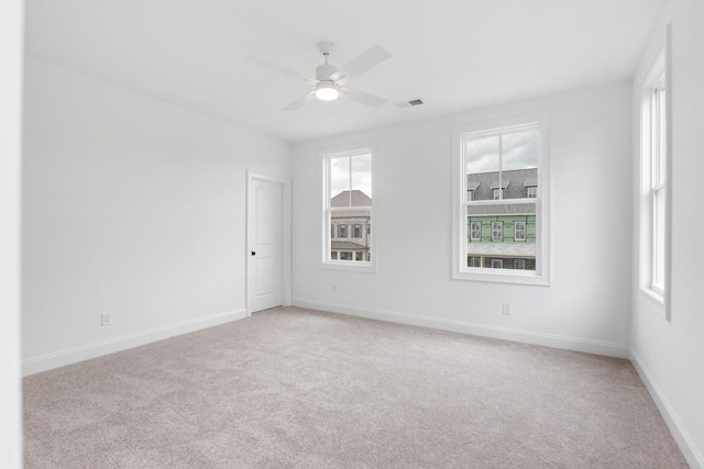 3150 Long Branch Cir, Franklin, TN 37064 - unfurnished room featuring light carpet, plenty of natural light, baseboards, and a ceiling fan