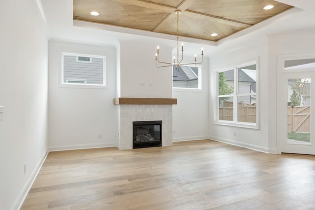 3150 Long Branch Cir, Franklin, TN 37064 - unfurnished living room featuring light wood-style flooring, plenty of natural light, a chandelier, a fireplace, and recessed lighting