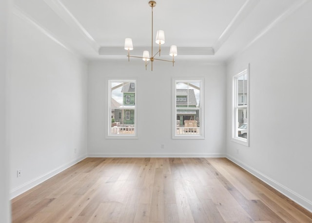 3150 Long Branch Cir, Franklin, TN 37064 - empty room with a raised ceiling, a chandelier, light wood-type flooring, and baseboards