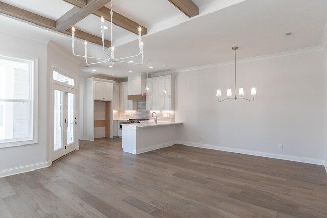 3168 Long Branch Cir, Franklin, TN 37064 - kitchen featuring a chandelier, a peninsula, decorative backsplash, wood finished floors, and recessed lighting