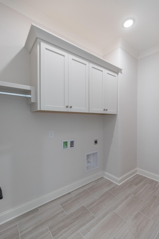 3168 Long Branch Cir, Franklin, TN 37064 - washroom featuring hookup for an electric dryer, hookup for a washing machine, cabinet space, wood finish floors, and baseboards