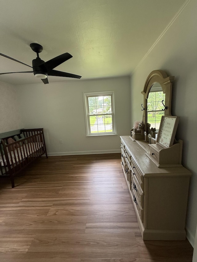 1704 Deer Hollow Dr W, Lawrenceburg, TN 38464 - bedroom with multiple windows, wood finished floors, and a ceiling fan