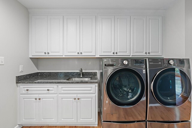 2952 Carters Creek Station Rd, Columbia, TN 38401 - laundry room featuring cabinet space and washing machine and clothes dryer
