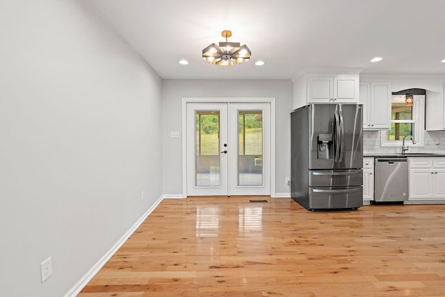 2952 Carters Creek Station Rd, Columbia, TN 38401 - kitchen featuring stainless steel appliances, a chandelier, a sink, white cabinets, and recessed lighting