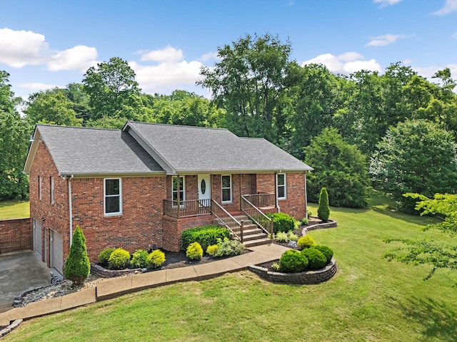 2952 Carters Creek Station Rd, Columbia, TN 38401 - ranch-style home with a front yard, a garage, roof with shingles, brick siding, and driveway