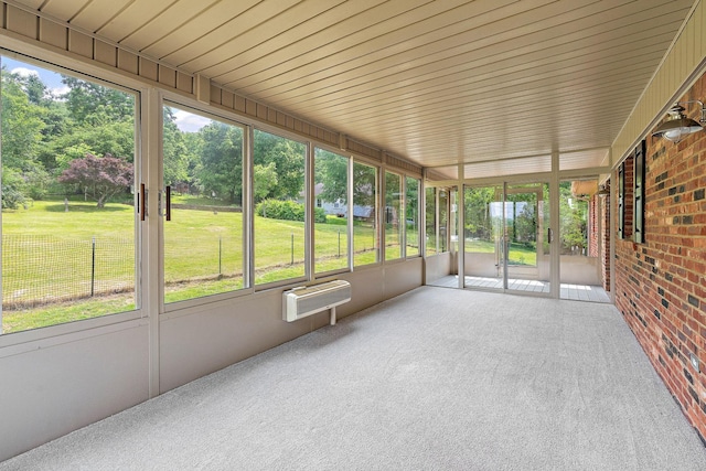 2952 Carters Creek Station Rd, Columbia, TN 38401 - unfurnished sunroom featuring plenty of natural light, an AC wall unit, and view of scattered trees