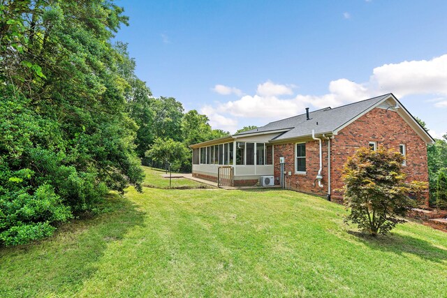 2952 Carters Creek Station Rd, Columbia, TN 38401 - view of green lawn featuring a sunroom and ac unit