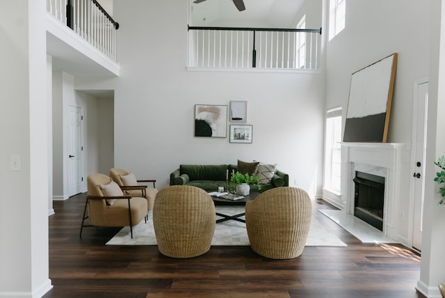 307 Fletcher Ct, Franklin, TN 37067 - living area featuring a high ceiling, wood finished floors, a high end fireplace, a ceiling fan, and baseboards