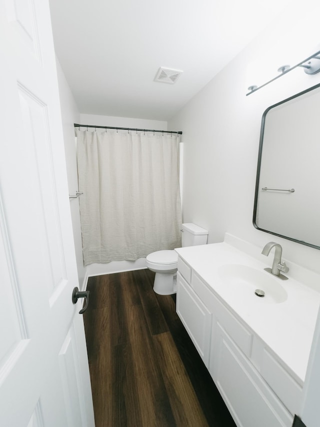 307 Fletcher Ct, Franklin, TN 37067 - bathroom featuring vanity, toilet, wood finished floors, and curtained shower