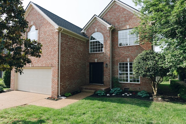 307 Fletcher Ct, Franklin, TN 37067 - view of front facade with concrete driveway, a front lawn, a garage, and brick siding