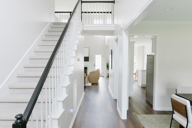 307 Fletcher Ct, Franklin, TN 37067 - stairs with wood finished floors, crown molding, and baseboards
