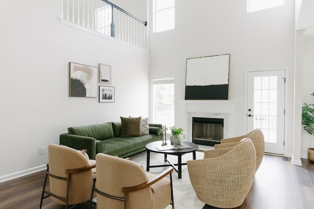 307 Fletcher Ct, Franklin, TN 37067 - living area featuring a high ceiling, wood finished floors, plenty of natural light, a fireplace, and baseboards