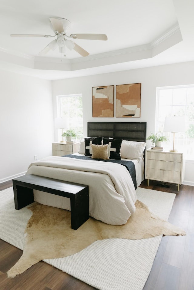 307 Fletcher Ct, Franklin, TN 37067 - bedroom featuring a raised ceiling, ornamental molding, wood finished floors, and ceiling fan
