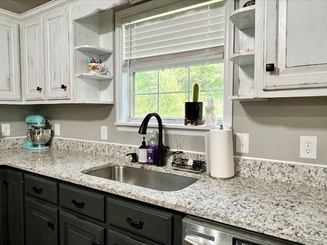 831 Harris Rd, Dickson, TN 37055 - kitchen with a sink, open shelves, white cabinets, stainless steel dishwasher, and dark cabinets