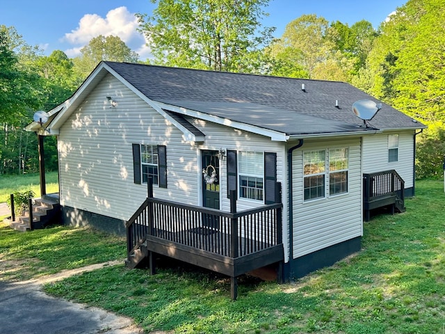 831 Harris Rd, Dickson, TN 37055 - back of house featuring a yard, a wooden deck, and roof with shingles